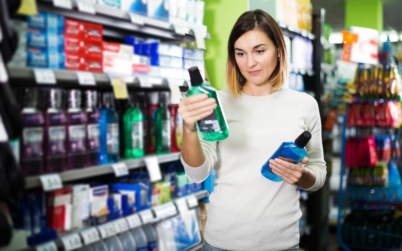 woman-comparing-ingredients-of-mouthwash-Bradford-Dentist