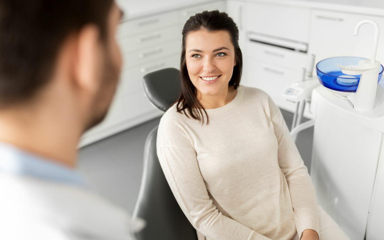 A woman sitting in a dentist's chair - what-can-I-do-to-help-manage-dental-anxiety