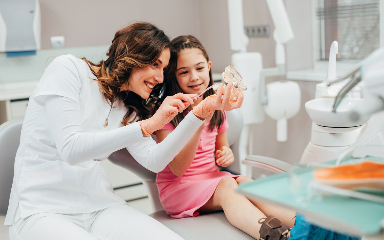 A dentist showing a preventative-bradford-dental-care-for-kids-best-family-dentist-near-me